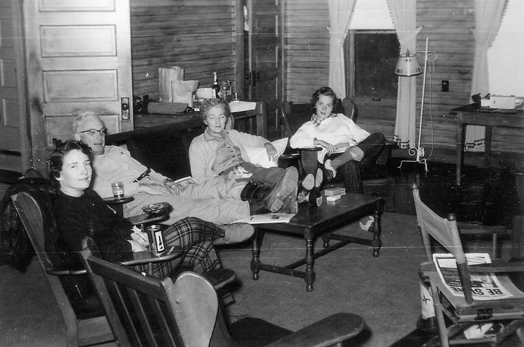 (above) The living area in 1952 was quite the social hangout. From this photo, I can tell that the walls were composed of exposed unpainted shiplap boards or beadboard. And since the family seems to be gathered on an area rug, I'm assuming the floors were wooden with no wall-to-wall carpeting. AND (drumroll) I spy traditional spring roller shades on the windows!