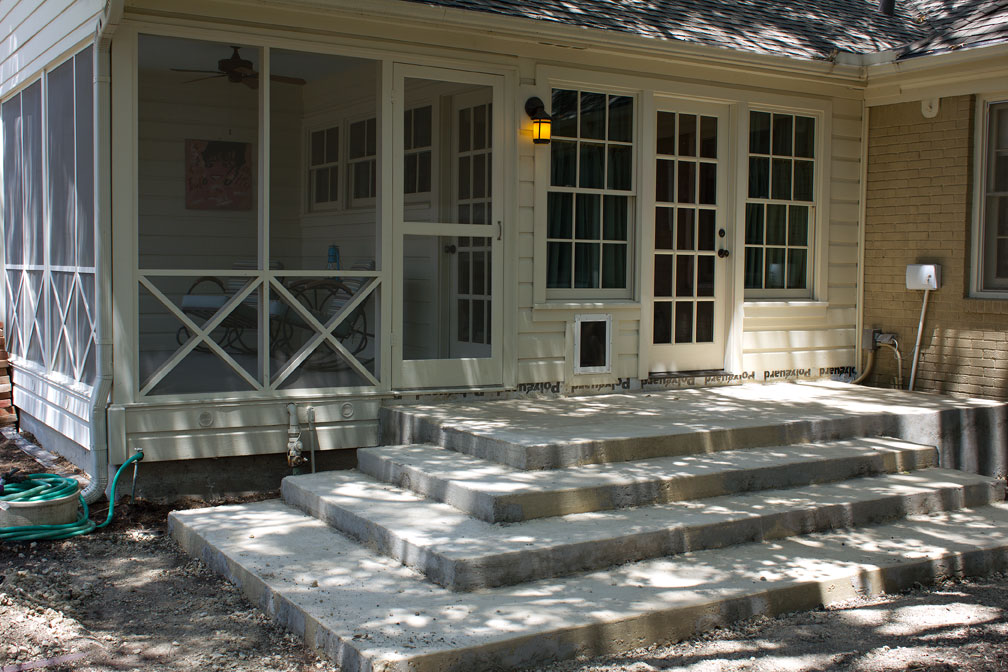 The back steps after the forms were removed on Friday, day 9. Eventually, brick pavers will be installed, covering all the concrete. Click the photo for a larger version.