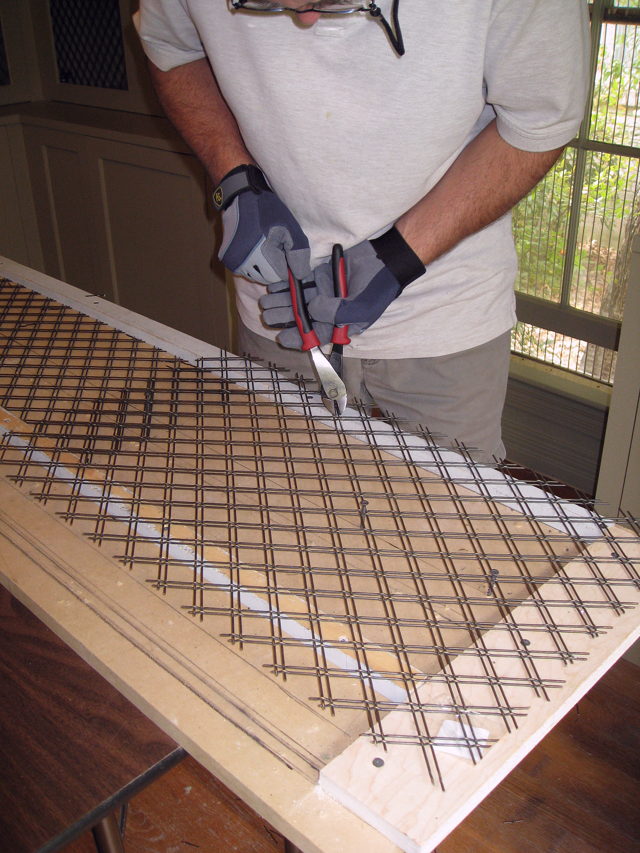 (above) Bert, my general contractor, is cutting the wire to size using an adjustable template.