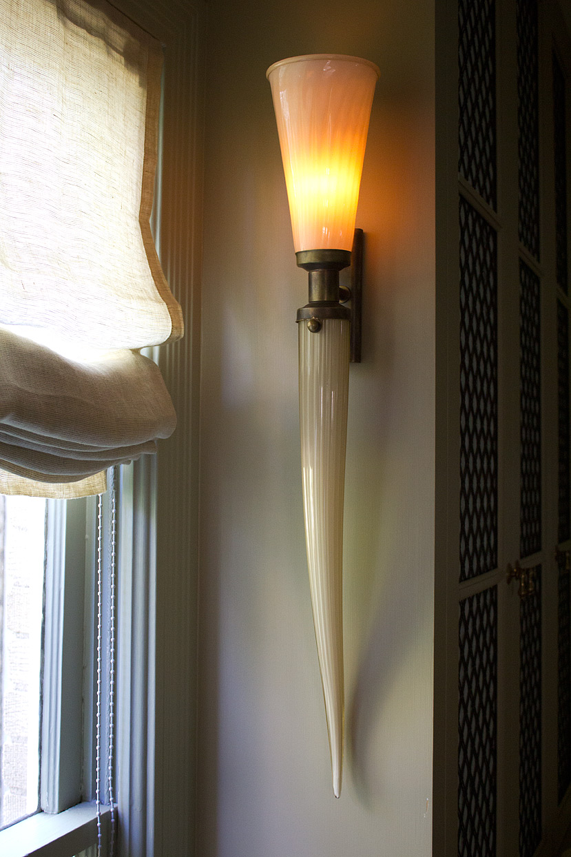 (above) The sconces are turned on by a remote control device, and the switch is located in the attic.