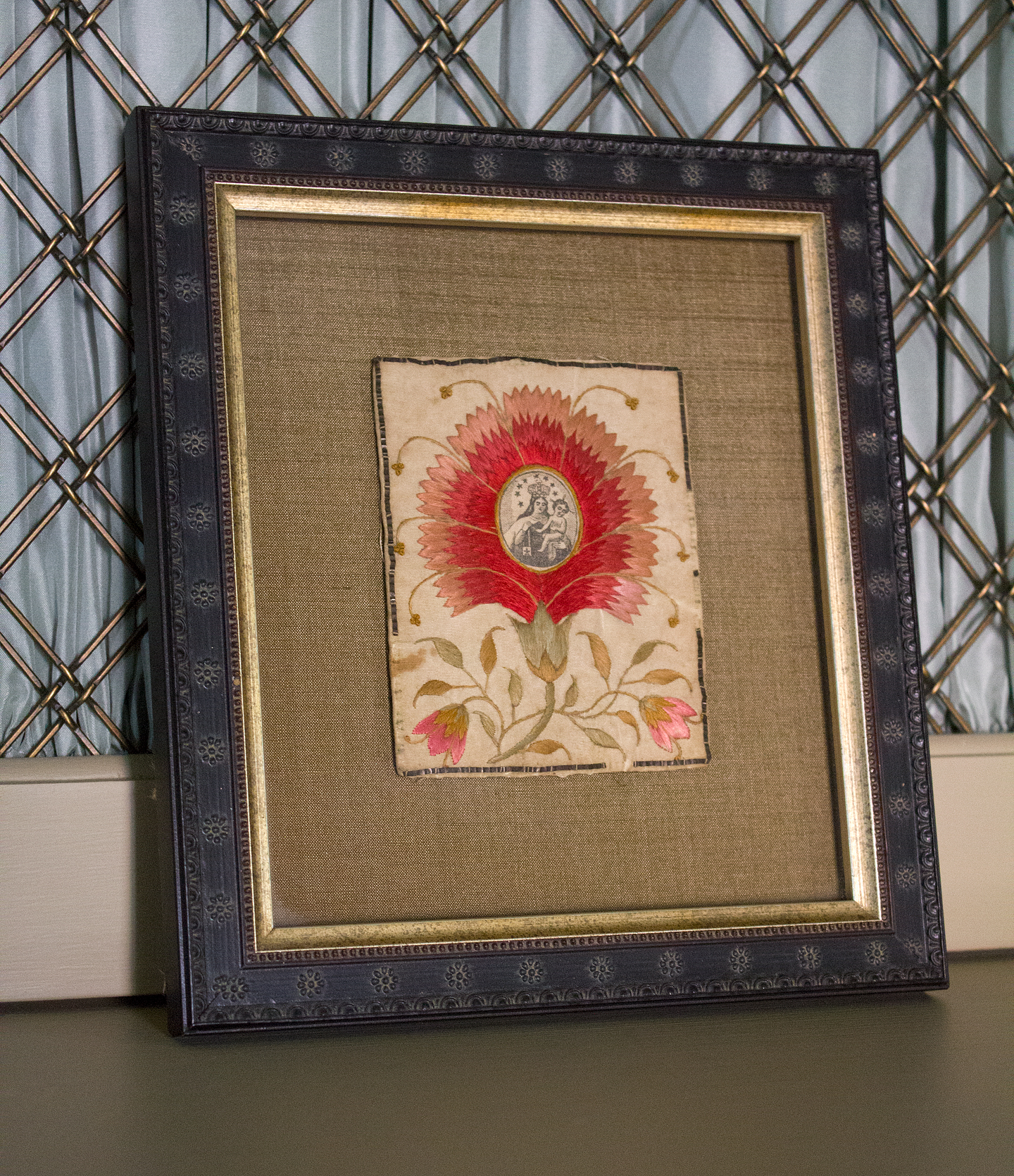 A scrap of embroidered fabric found in an antique mall.