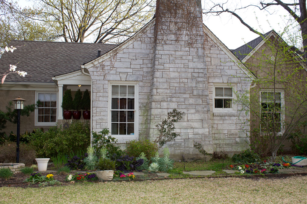 (above) This was taken on March 19, 2011. I had just finished stripping all the dead ivy off of the walls. Last year’s winter was brutal. Also, I had just finished the annual shearing of all the ornamental grasses down to their bases.