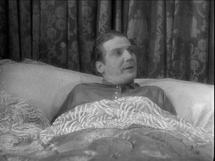 (above) His home in the bedroom. The gauze sheets are an interesting choice for his bed.
