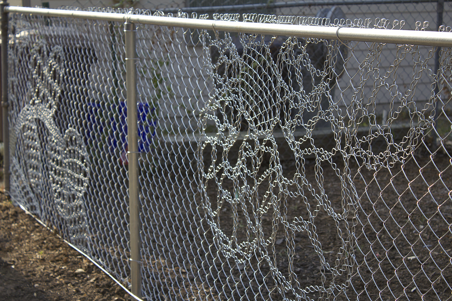 This detail view of the fence was taken in the afternoon.