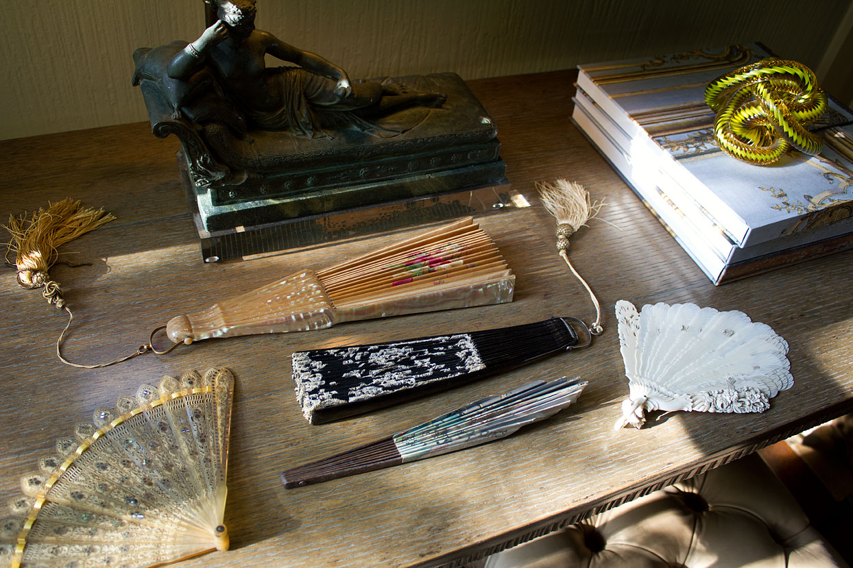 Look but don’t touch. Well… that rule only applies to the carved ivory fan on the right. The ribbon threaded through the blades needs to be replaced before it can perform like it should.