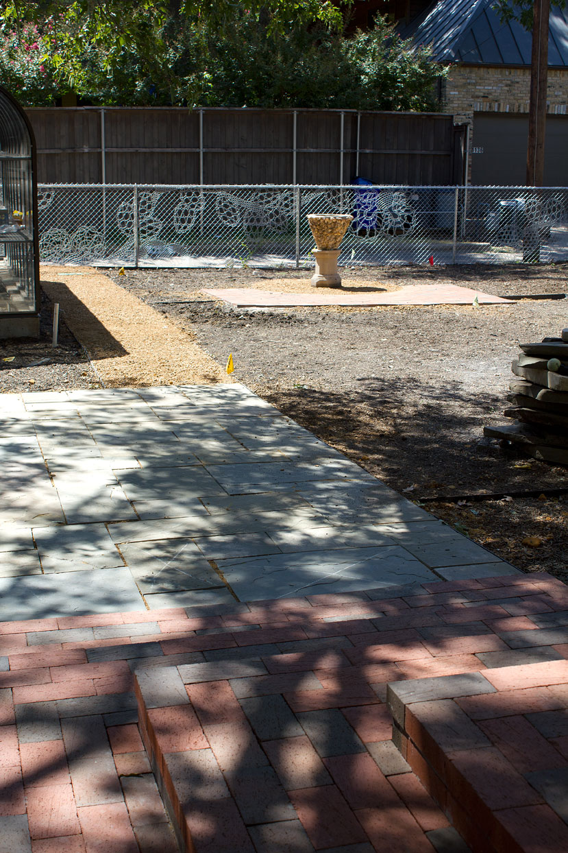 (above looking towards the alley) To the right of the path and stone pad is where the sun garden will be installed. To the left will be another shade garden.