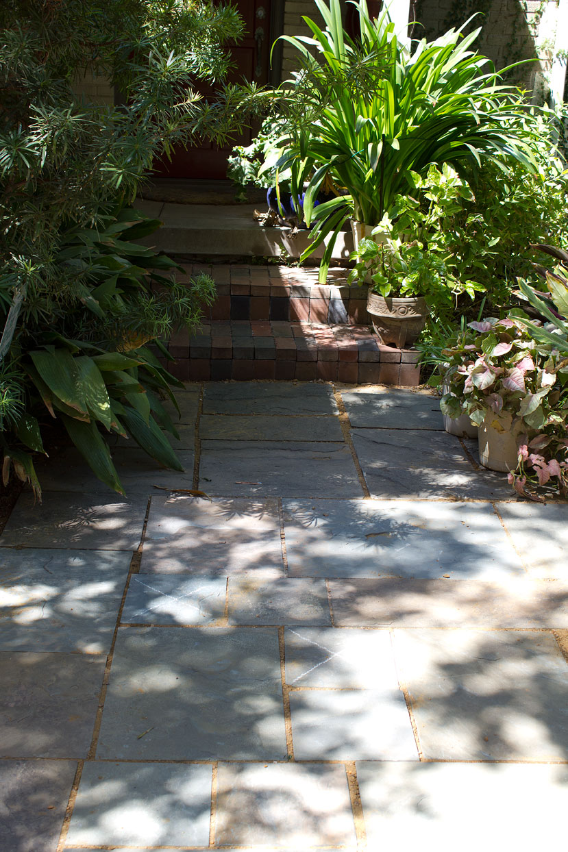 (above) At the front door the stone has been extended across the driveway replacing a large expanse of crumbling concrete.