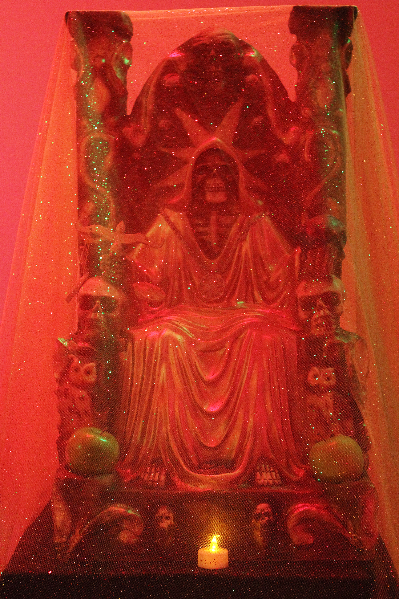 (above) The two photos are details of the first gallery's alter scene. The top one is a depiction of Saint Death.